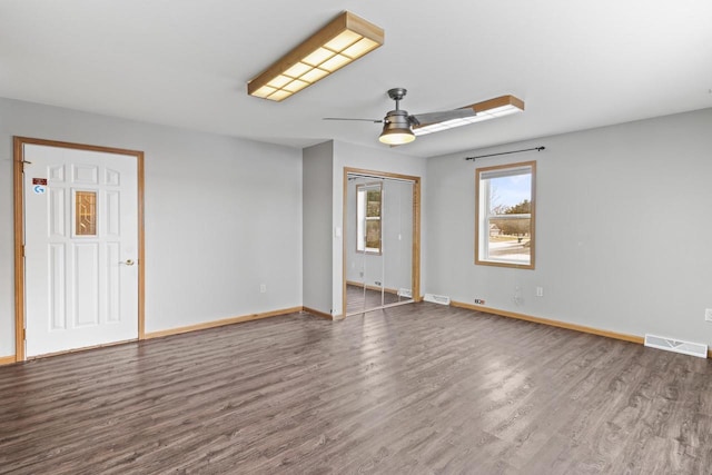 unfurnished room with hardwood / wood-style floors and ceiling fan