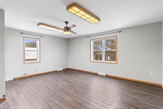 unfurnished room with hardwood / wood-style floors and ceiling fan