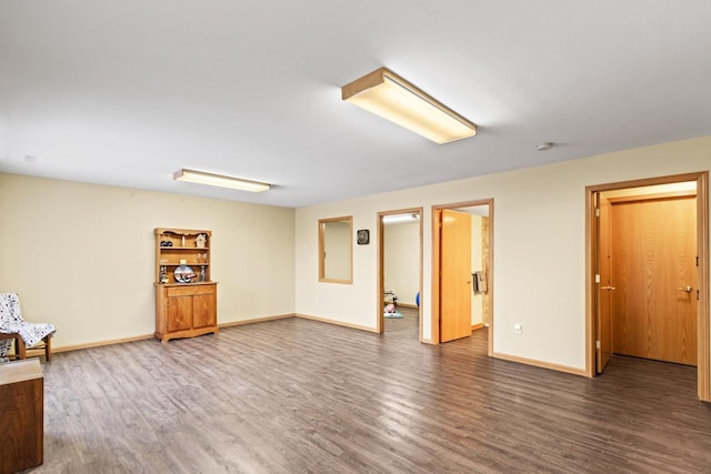 basement with hardwood / wood-style floors