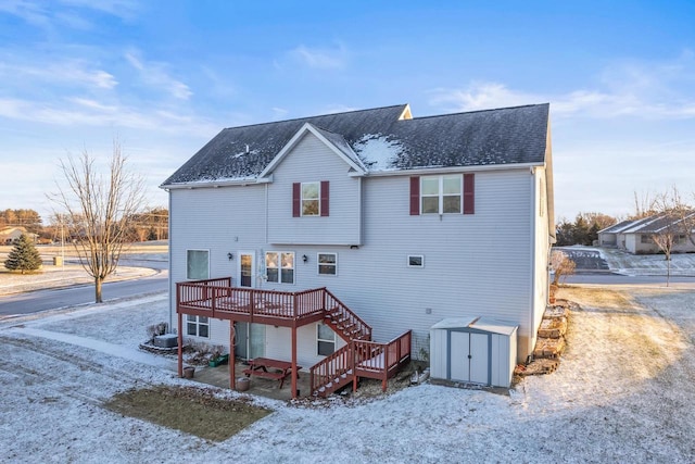 back of property featuring a wooden deck