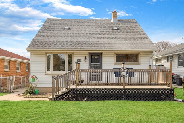 back of house with a lawn and a deck