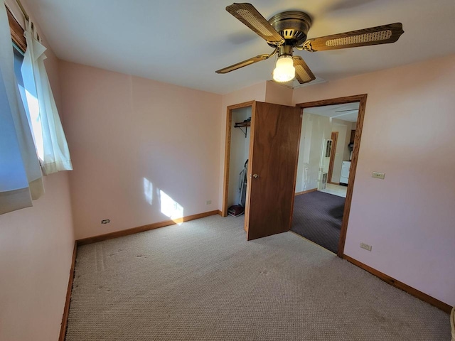 unfurnished room with light carpet and ceiling fan