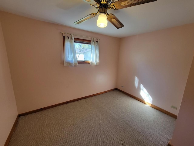 unfurnished room featuring light colored carpet and ceiling fan