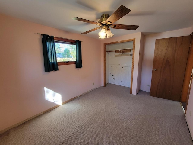 unfurnished bedroom with a closet, ceiling fan, and light colored carpet