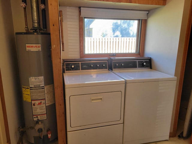 laundry area featuring washer and clothes dryer and water heater