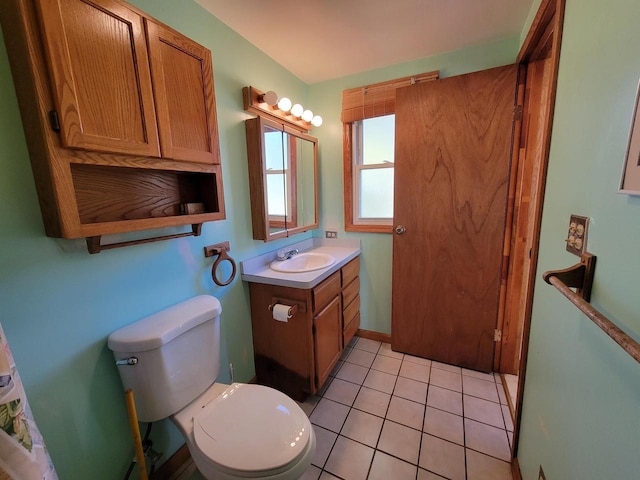 bathroom featuring vanity, toilet, and tile patterned floors