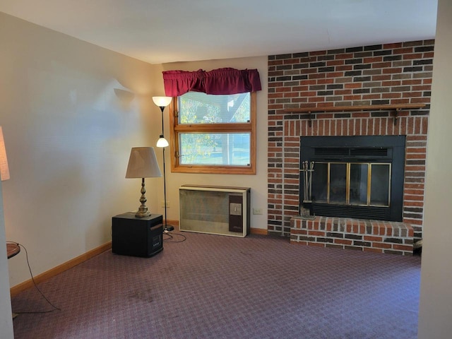 unfurnished living room with carpet floors and a fireplace