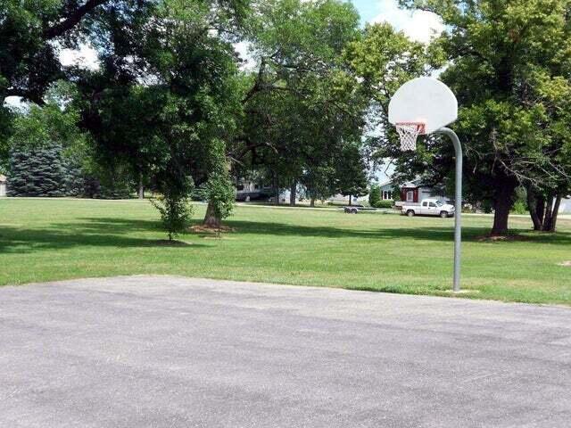 view of basketball court featuring a yard