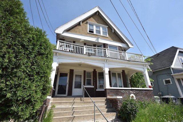 view of front of house featuring covered porch and a balcony