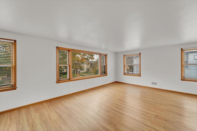 empty room with light wood-type flooring