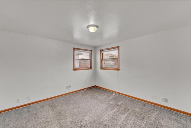 unfurnished room with carpet floors