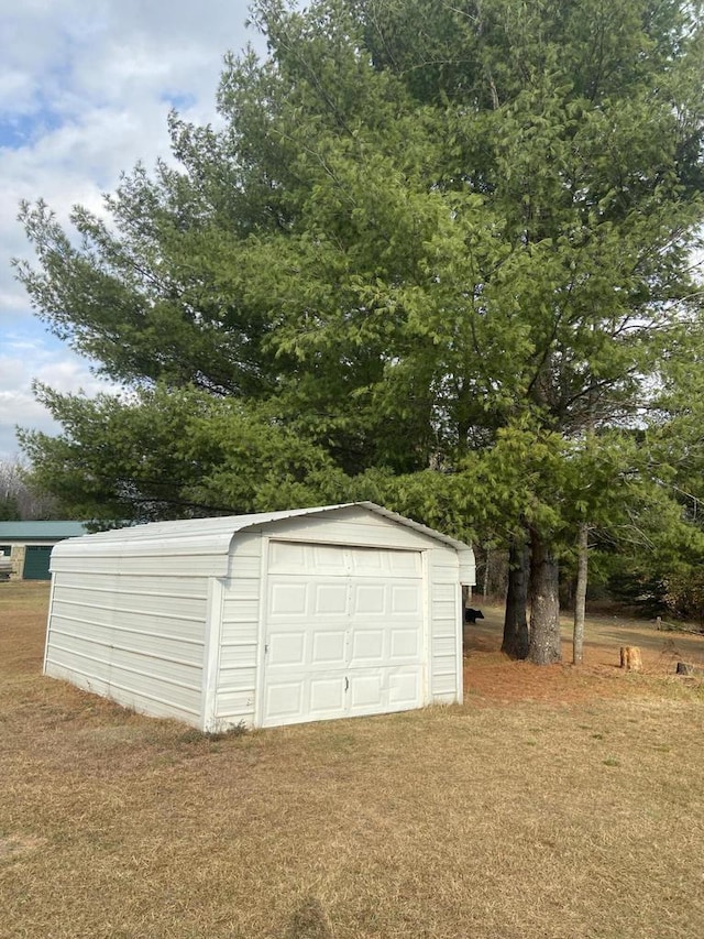 garage with a lawn