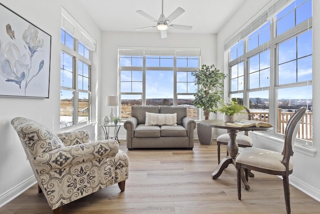 sunroom / solarium with ceiling fan