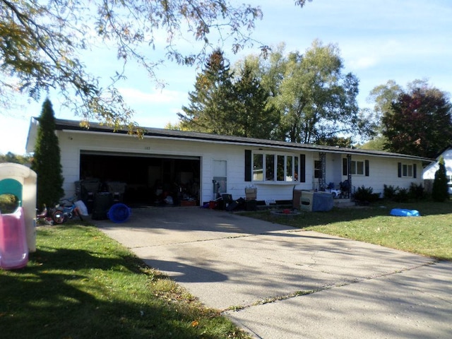 single story home featuring a front yard and a garage