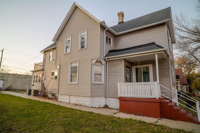 back of house with a yard