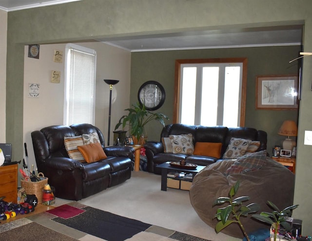 carpeted living room with ornamental molding