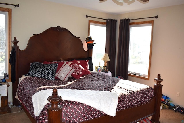 bedroom with ceiling fan and carpet floors