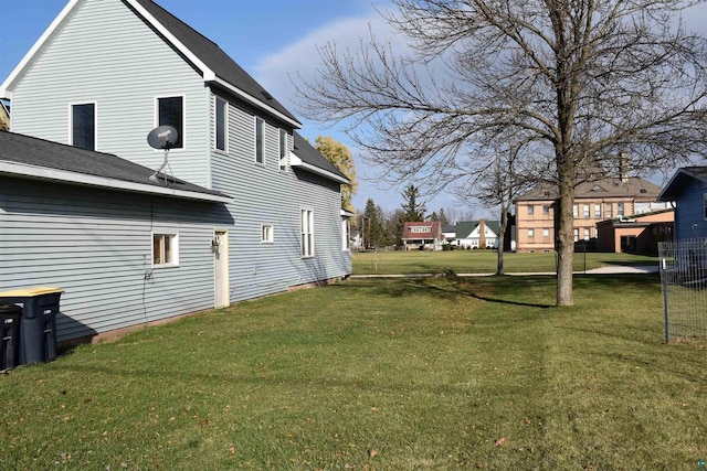 view of property exterior with a yard