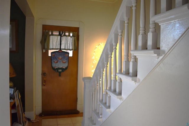 stairs with tile patterned floors