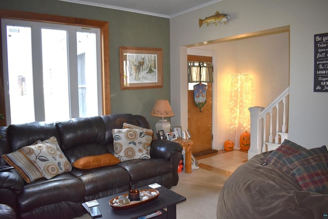 carpeted living room with a wealth of natural light and ornamental molding