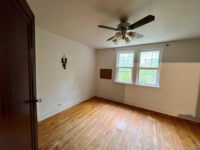 empty room with light hardwood / wood-style floors and ceiling fan