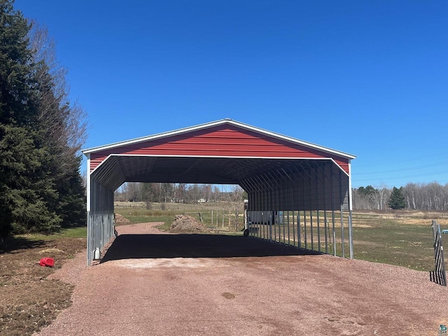 view of parking / parking lot featuring a carport