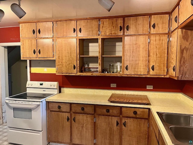 kitchen featuring sink and white electric stove