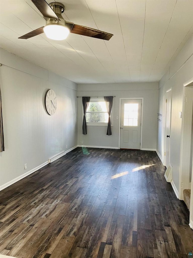 spare room featuring ceiling fan and dark hardwood / wood-style flooring