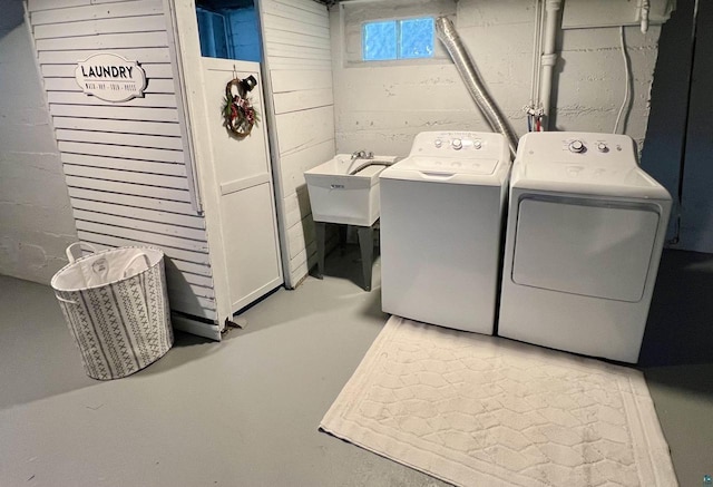 laundry room featuring washing machine and dryer and sink