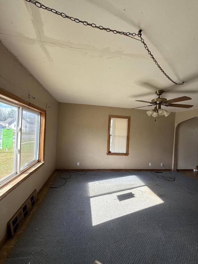 spare room with ceiling fan and lofted ceiling