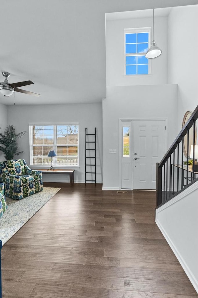 entrance foyer with dark wood-type flooring and ceiling fan