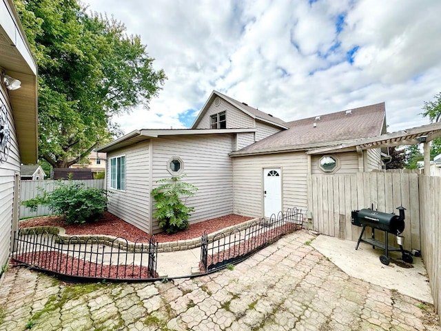 rear view of property featuring a patio