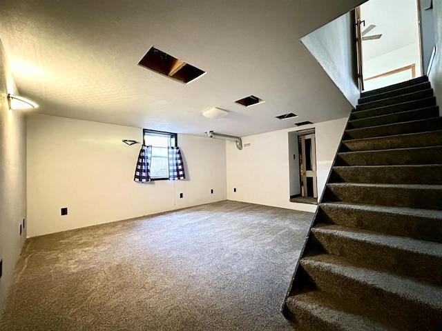 unfurnished living room featuring carpet