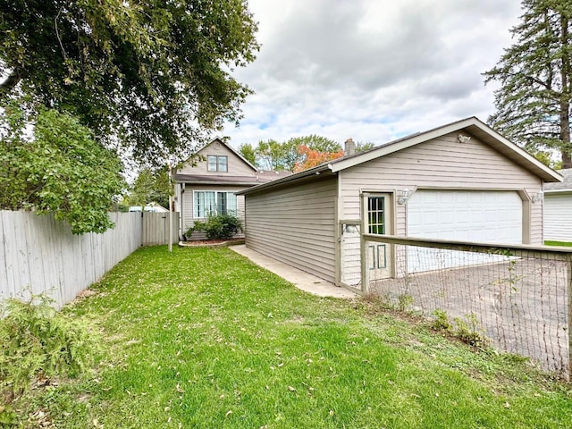 exterior space featuring a yard and a garage