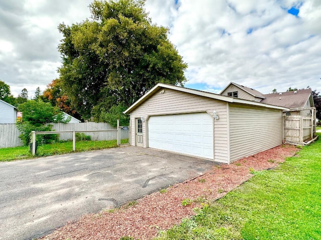 garage featuring a yard