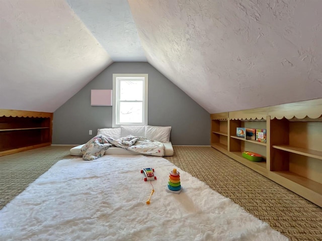 bedroom featuring lofted ceiling, carpet, and a textured ceiling