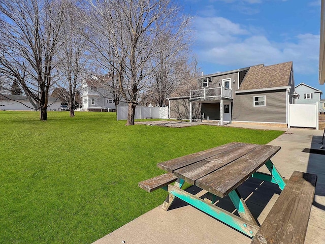 view of yard featuring a deck and a patio