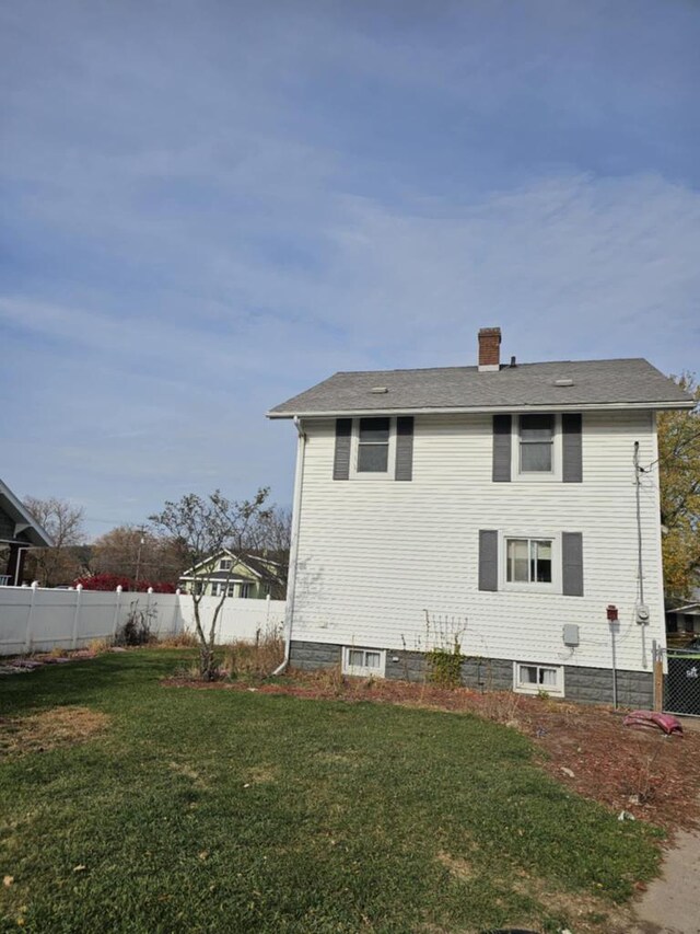 view of home's exterior featuring a yard