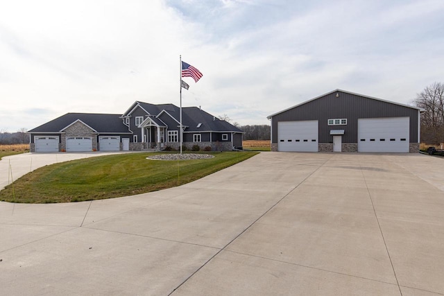 view of front facade with a garage and a front yard