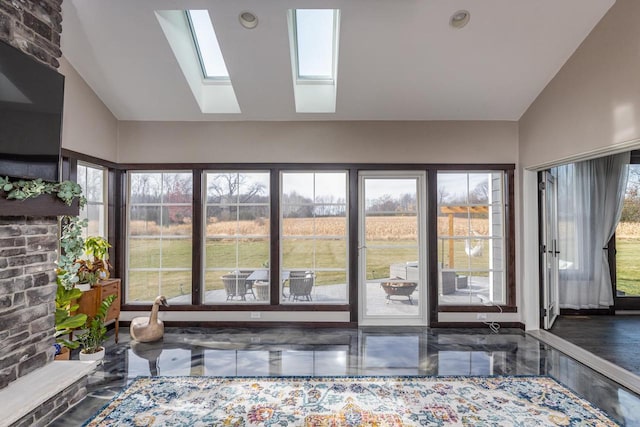 sunroom with a wealth of natural light and vaulted ceiling