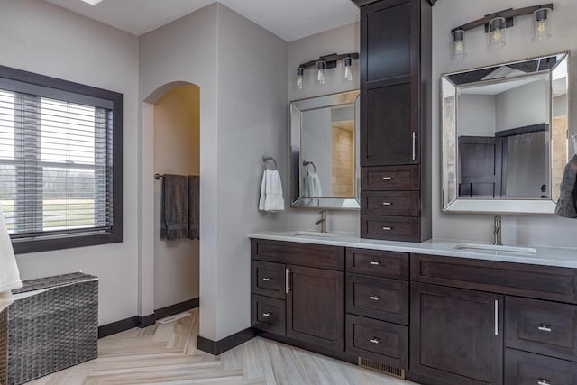 bathroom featuring vanity and parquet flooring