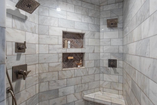 bathroom with tiled shower