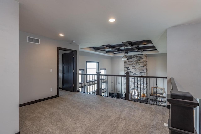 interior space with coffered ceiling, carpet flooring, and beam ceiling