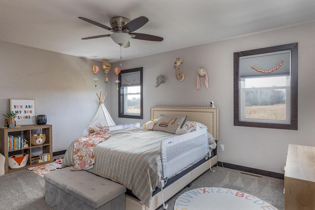 carpeted bedroom with ceiling fan