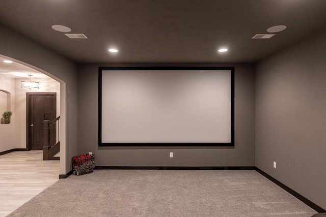 cinema featuring light hardwood / wood-style floors