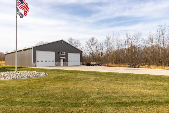 garage featuring a lawn