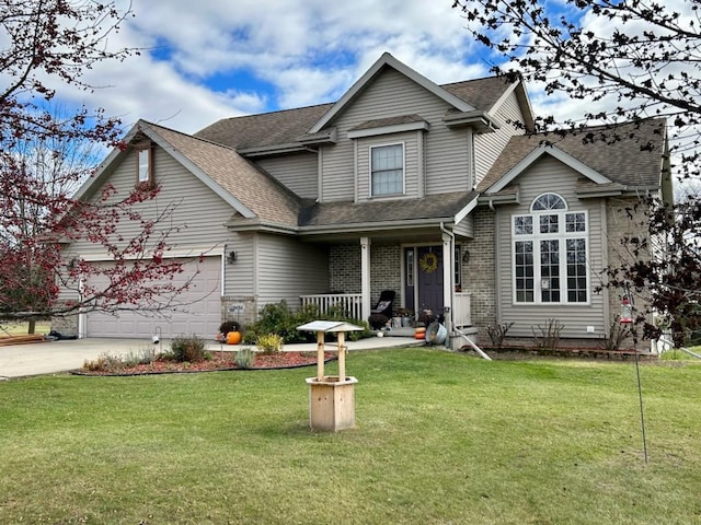 N4266 Cherokee Ct, Markesan, WI 53946 - traditional-style house featuring covered porch, roof with shingles, concrete driveway, a front yard, and brick siding