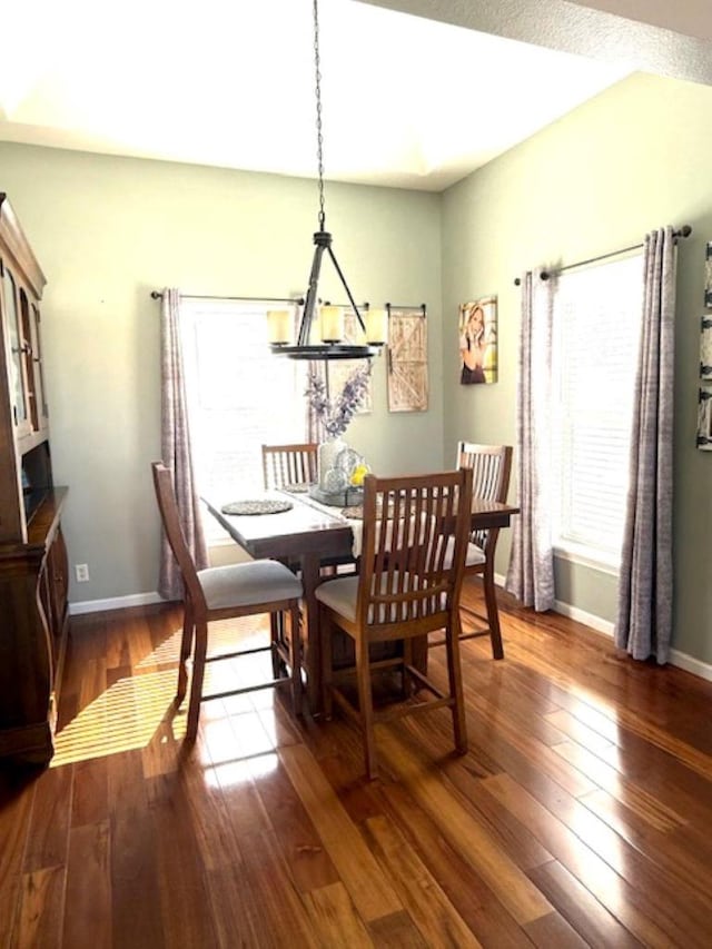 N4266 Cherokee Ct, Markesan, WI 53946 - dining area featuring dark wood-style flooring and baseboards