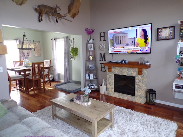 living room with hardwood / wood-style floors and a fireplace