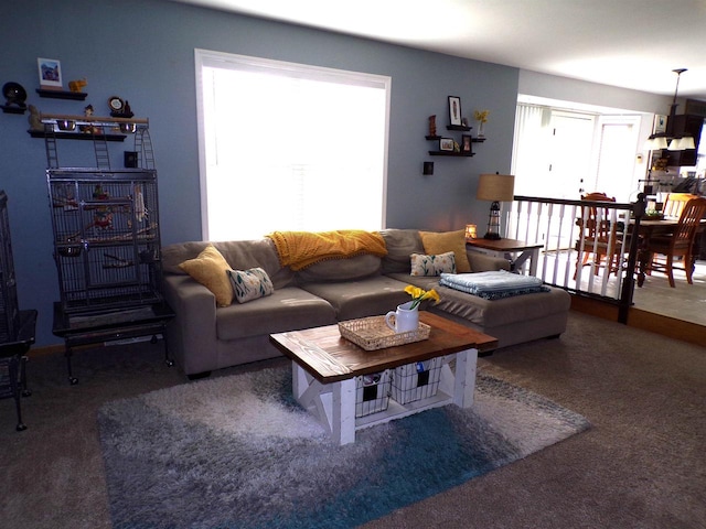 living room with carpet flooring and plenty of natural light